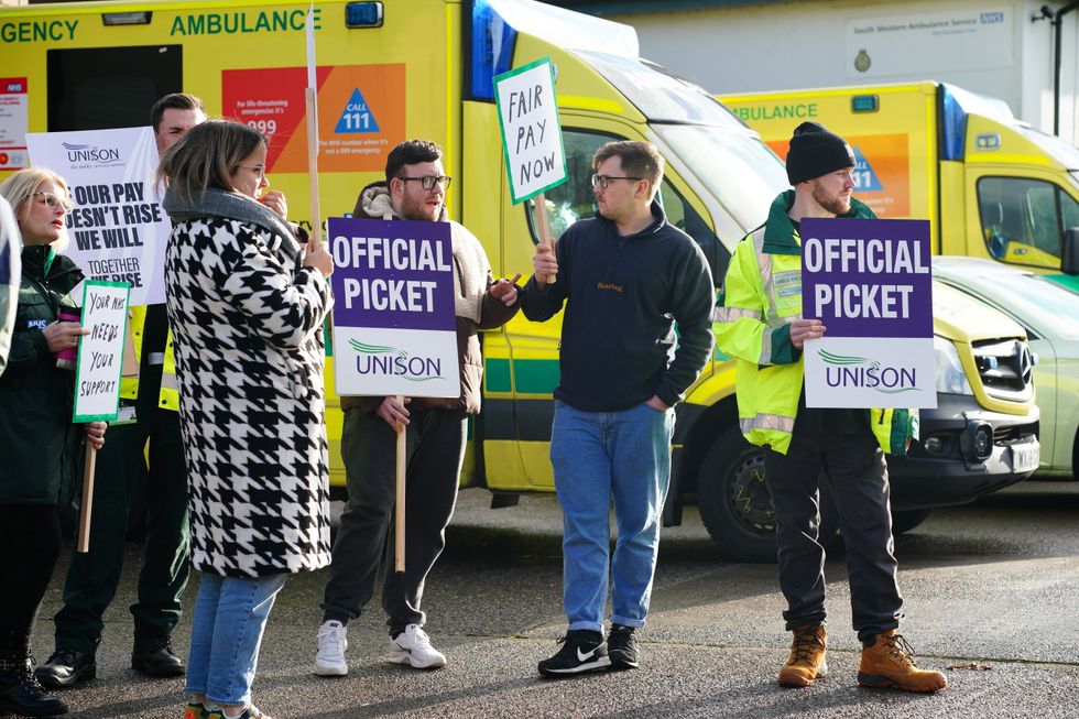 Ambulance workers on the picket line outside Soundwell Ambulance Station, Bristol, as paramedics, ambulance technicians and call handlers walk out in England and Wales, in a strike co-ordinated by the GMB, Unison and Unite unions over pay and conditions that will affect non-life threatening calls. Picture date: Wednesday December 21, 2022.