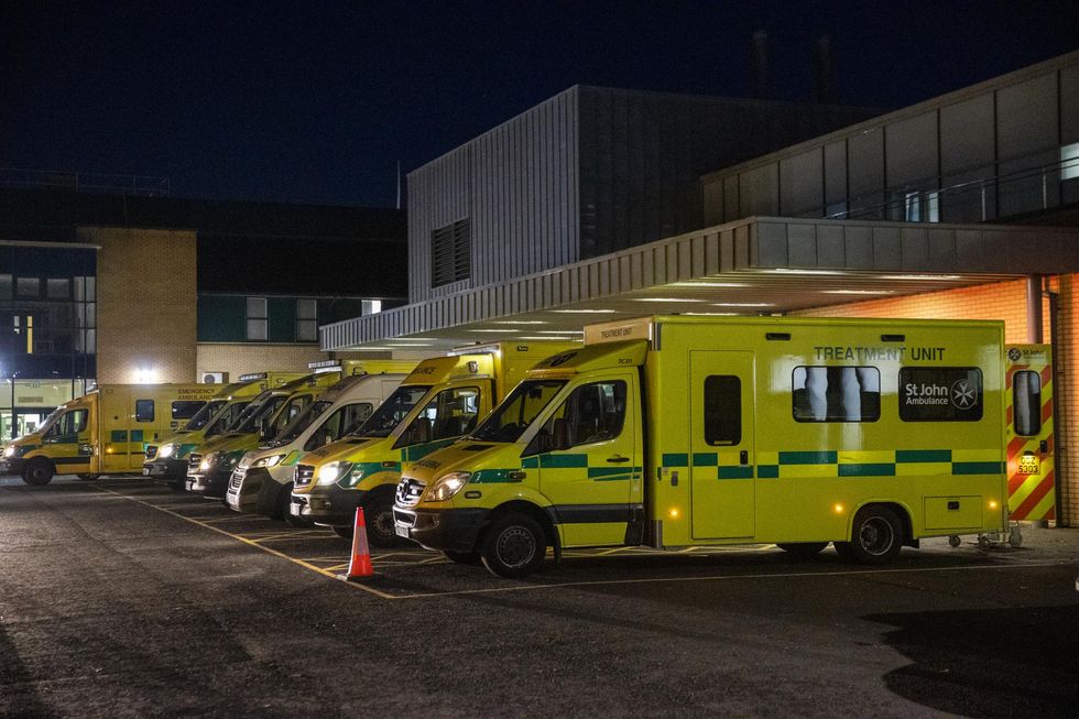 Ambulances at the entrance to the emergency department with a number of the vehicle with patients awaiting to be admitted, at Antrim Area Hospital, Co Antrim in Northern Ireland, as the emergency department and hospital is currently at full capacity.