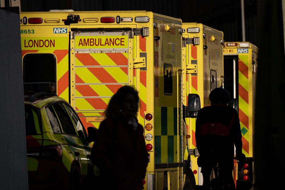 Ambulances waiting at an Emergency Department (A&E) at the Royal London hospital in London, as flu cases in hospitals in England are continuing to rise while ambulance handover delays have hit a new high, as the NHS continues to struggle with bed shortages and a surge in winter viruses.