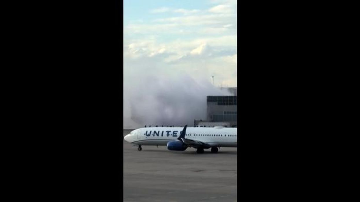American Airlines passengers flee onto wing of plane after Boeing jet ERUPTS in flames on airport runway