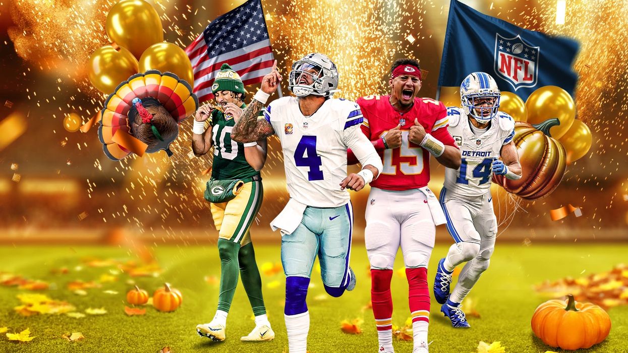 American football players in front of Thanksgiving decorations