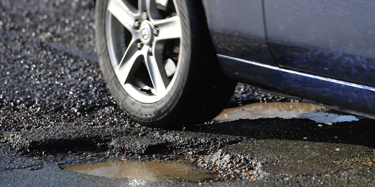 NextImg:Residents furious after council paints fresh road markings over potholes without filling them in