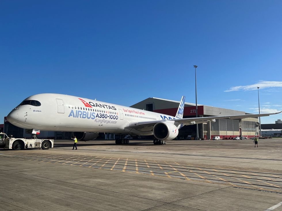 An Airbus A350-1000 test plane arrives at Sydney Airport as the backdrop for Qantas announcing an order for 12 of the planes in Sydney, Australia