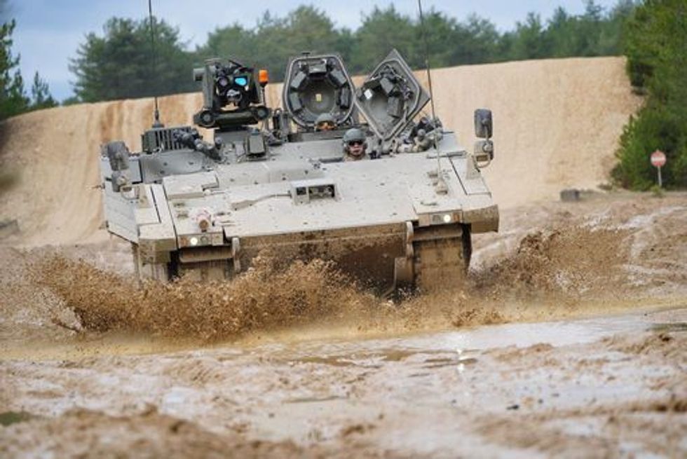 An Ajax Ares tank, an armoured personnel carrier, on the training range at Bovington Camp, a British Army military base in Dorset, during a visit by Defence Secretary Ben Wallace, who is viewing Ukrainian soldiers training on Challenger 2 tanks. Picture date: Wednesday February 22, 2023.