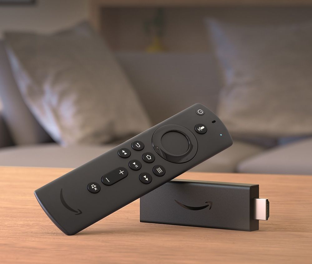 an amazon fire tv stick is pictured lying on its side on a table