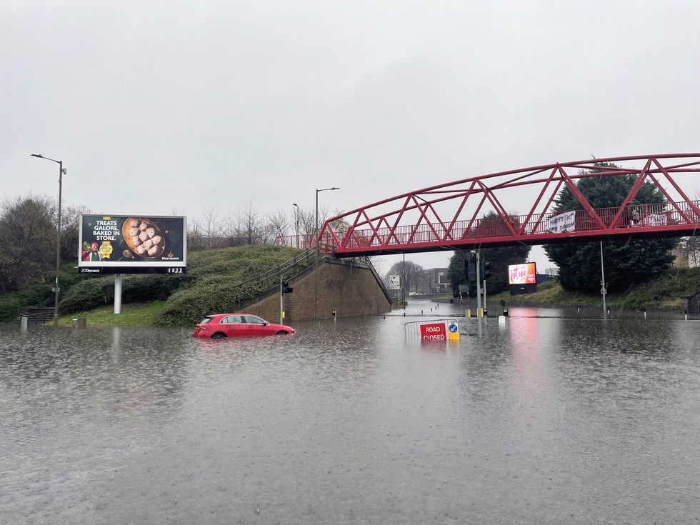 An amber weather warning in eastern Scotland has been extended as heavy rain drenches parts of the country, with flooding leading to school closures and disruption on roads and railways.