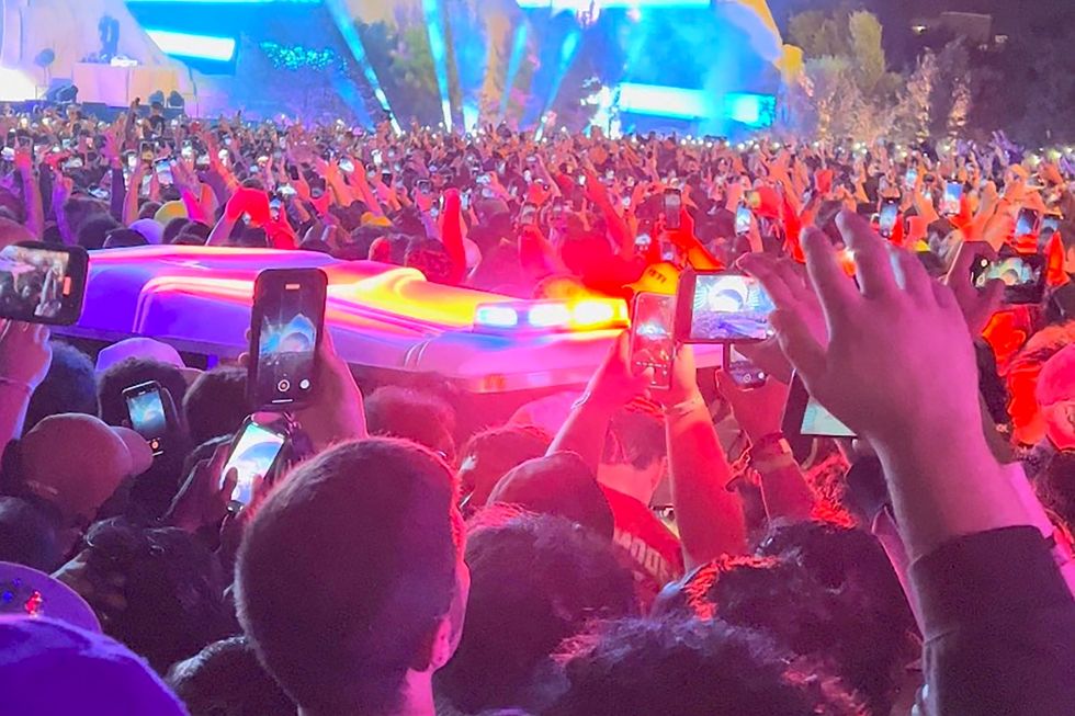 An ambulance is seen in the crowd during the Astroworld music festiwal in Houston, Texas, U.S., November 5, 2021 in this still image obtained from a social media video on November 6, 2021. Courtesy of Twitter @ONACASELLA /via REUTERS THIS IMAGE HAS BEEN SUPPLIED BY A THIRD PARTY. MANDATORY CREDIT. THIS IMAGE WAS PROCESSED BY REUTERS TO ENHANCE QUALITY, AN UNPROCESSED VERSION HAS BEEN PROVIDED SEPARATELY TPX IMAGES OF THE DAY