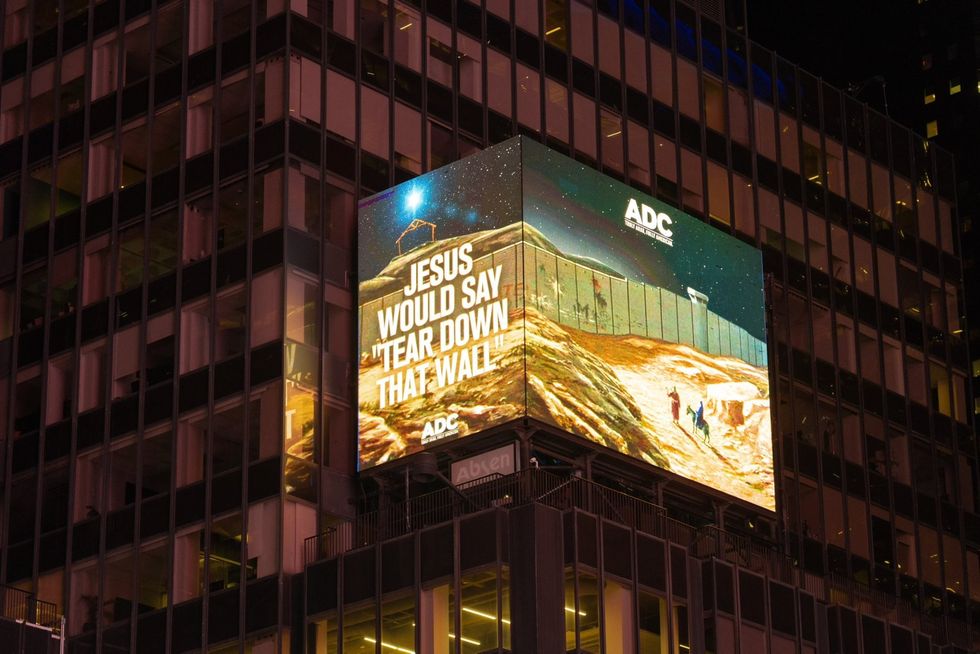 An anti-Donald Trump message also flashed up at Times Square