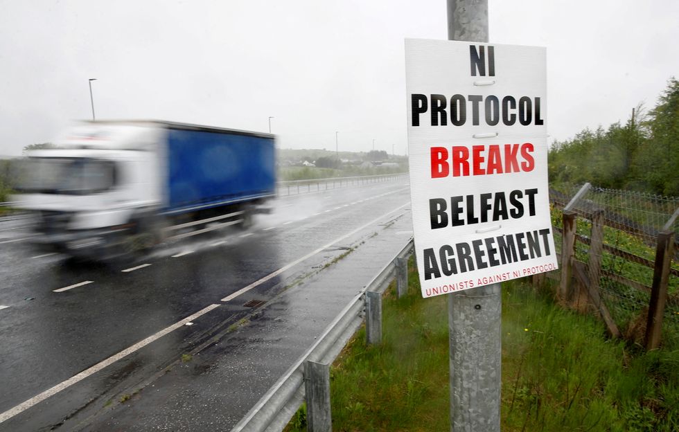 An anti-northern Ireland protocol poster is seen next to a road approaching Larne, Northern Ireland