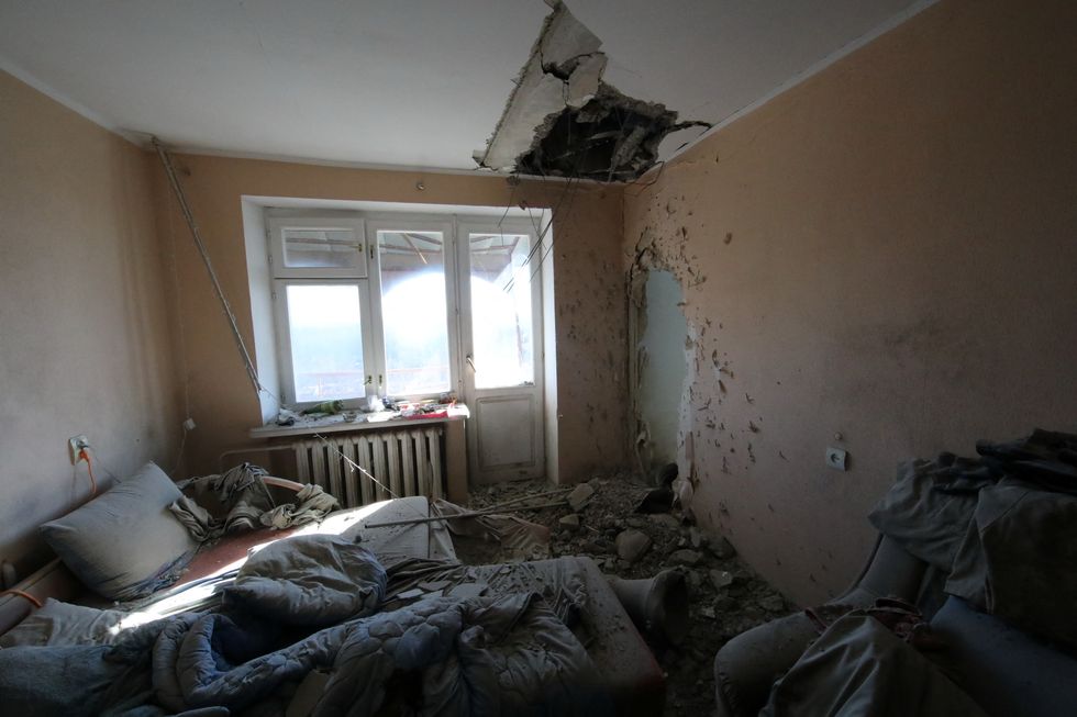 An apartment building interior view shows the aftermath of shelling in Kharkiv, Ukraine February 24, 2022. REUTERS/Vyacheslav Madiyevskyy