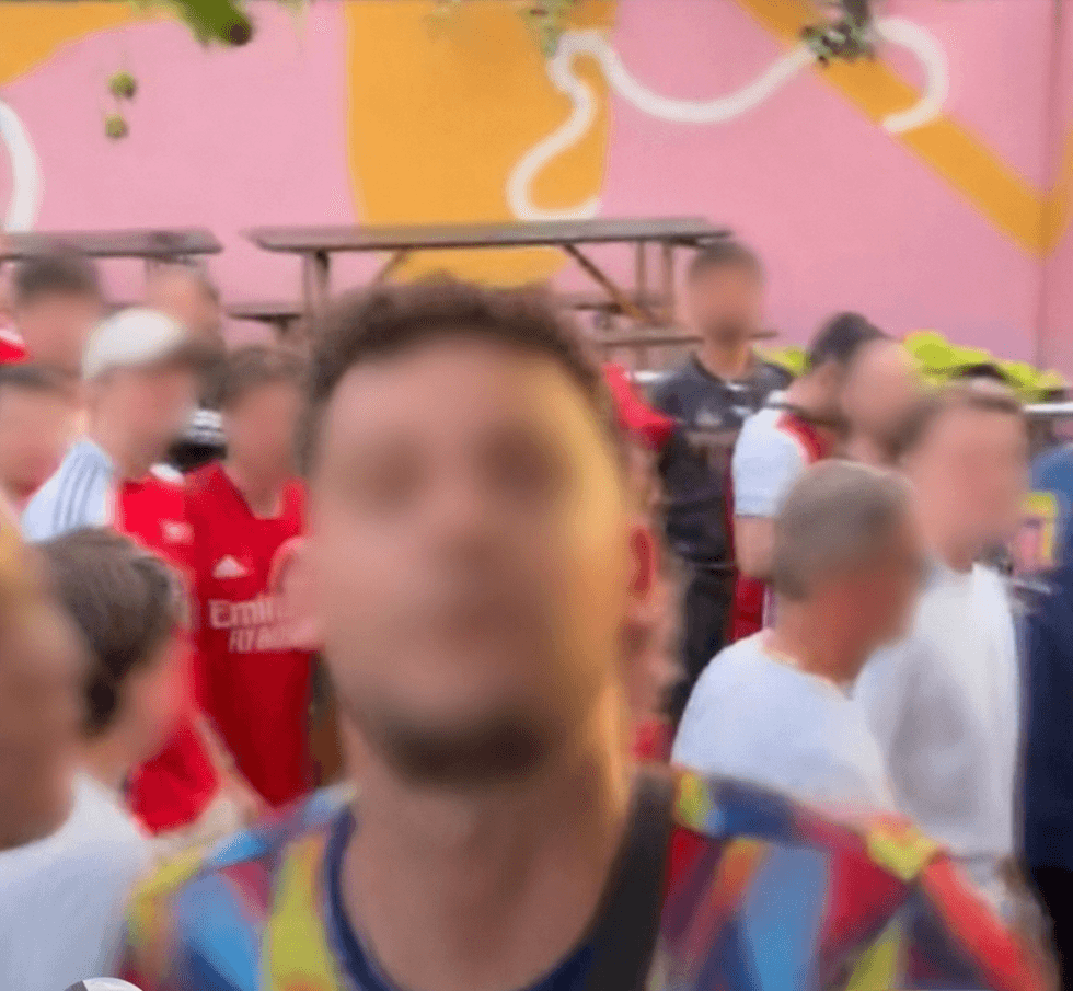 An Arsenal fan spat at someone who was mocking the Gunners following their Champions League final defeat to PSG