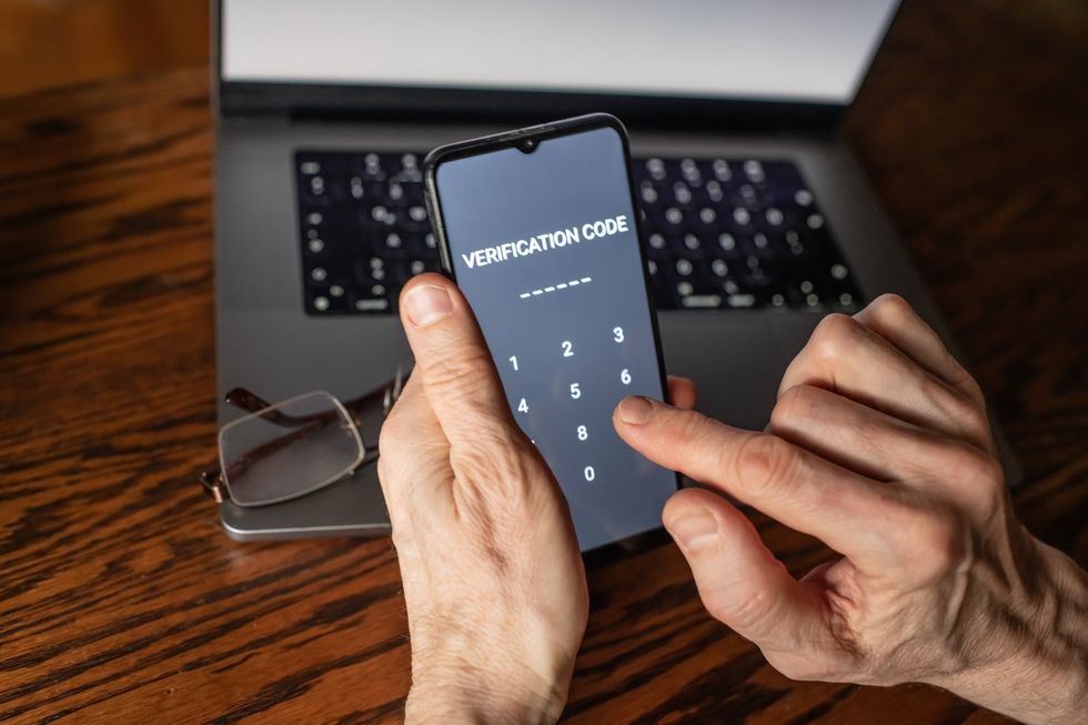 An elderly person using online banking