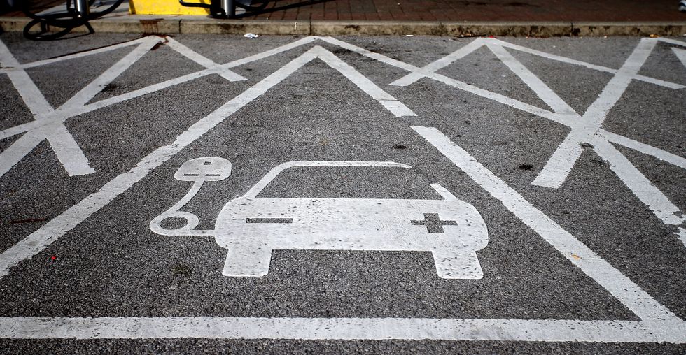 An electric car charging sign