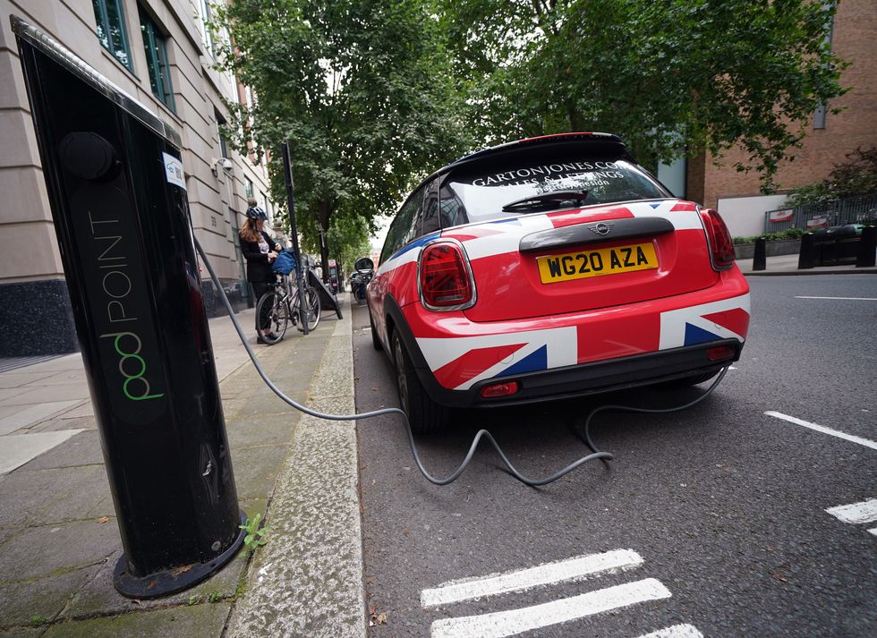 An electric Mini charging on the street