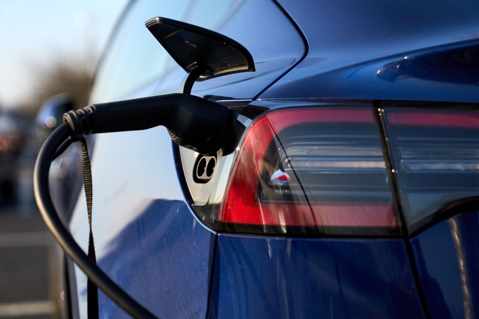 An electric vehicle being charged
