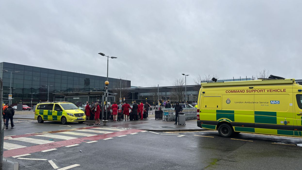 An emergency vehicle outside Heathrow Terminal 3 after a man has been arrested on suspicion of assaul