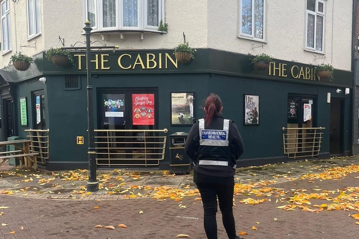 An environmental officer stood outside the pub