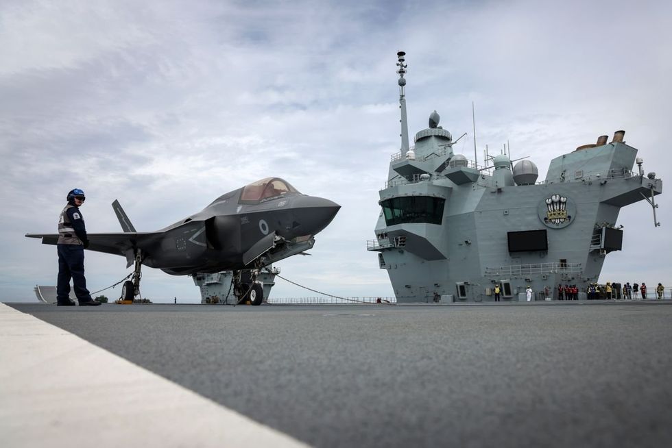 An F-35B fighter jet rests on the deck of HMS Prince of Wales