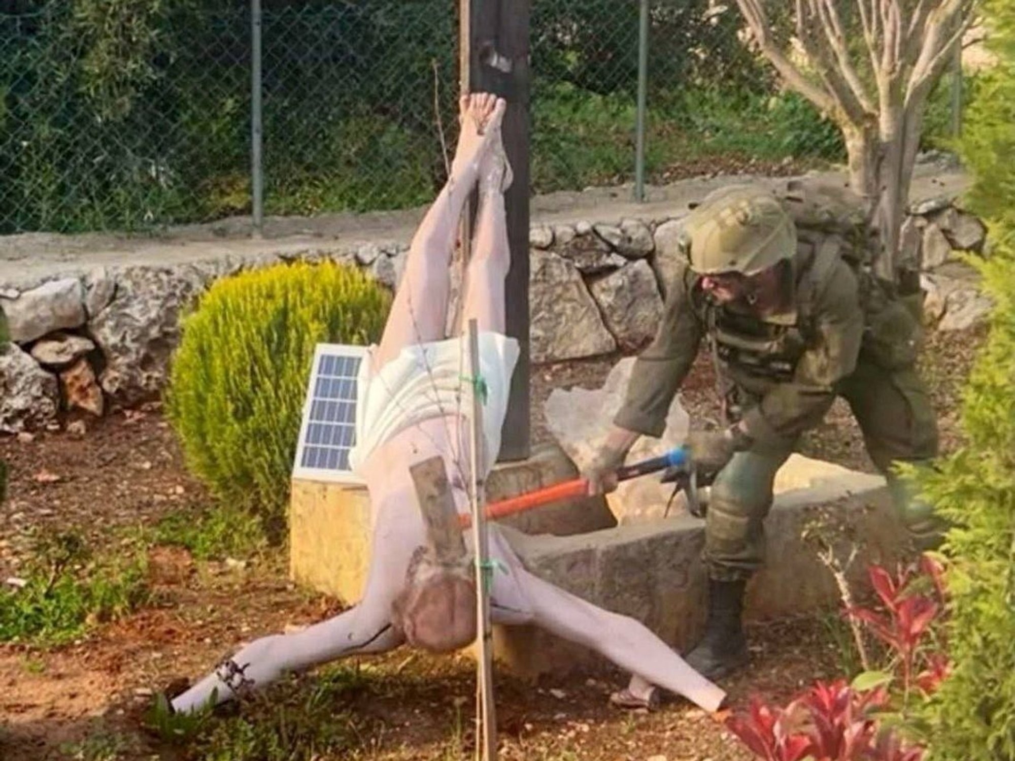 An IDF soldier destroying