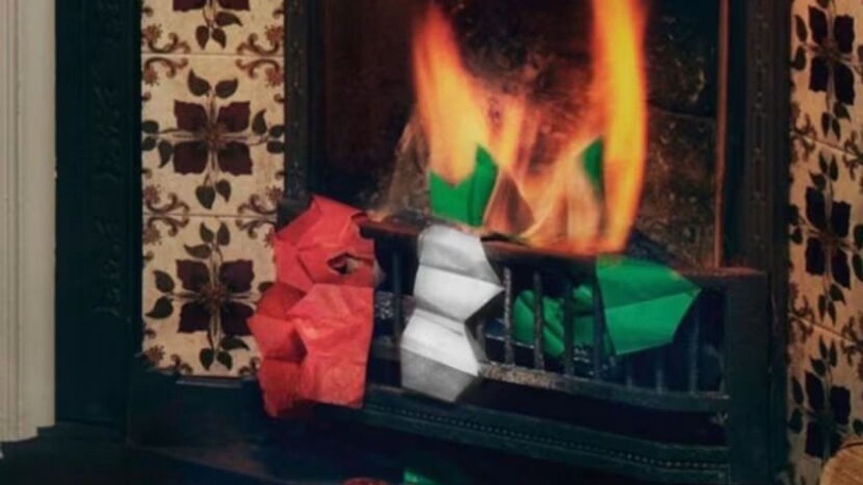 An image from M&S' Christmas outtakes showing festive hats being burnt