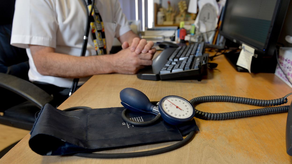 An image of a GP at his desk in Northern Ireland
