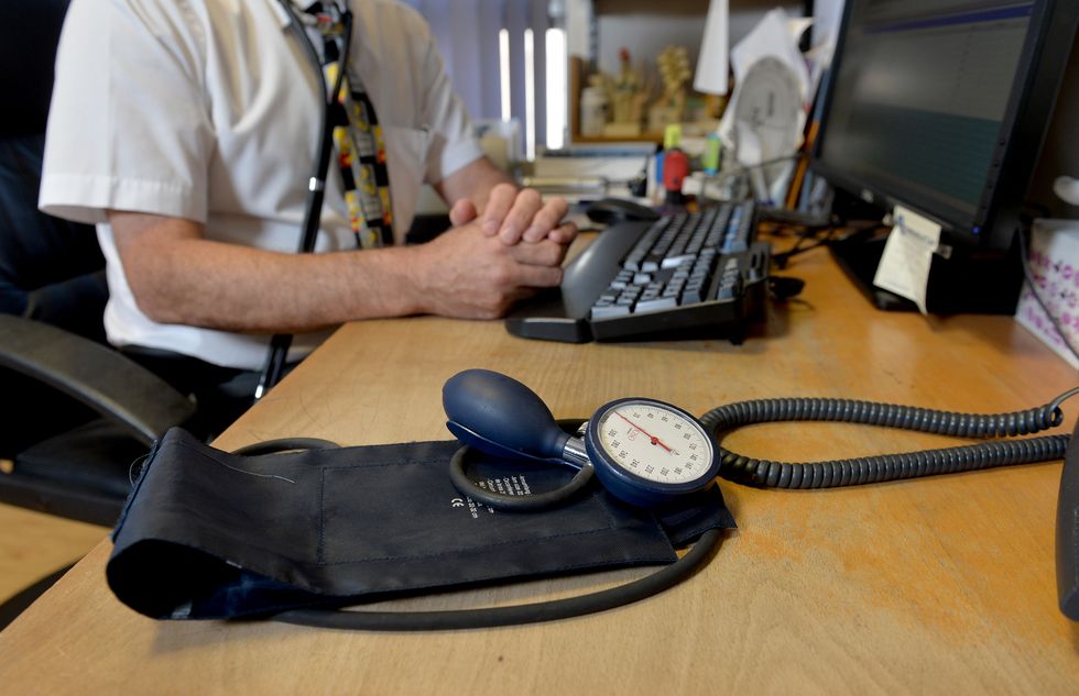 An image of a GP at his desk in Northern Ireland
