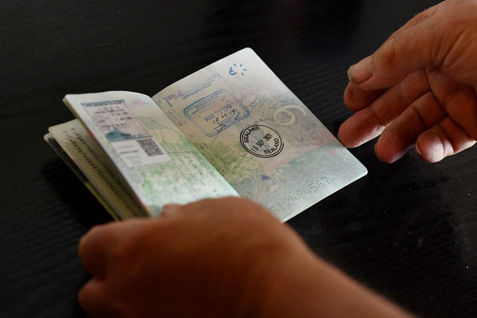 An image of a passport being stamped