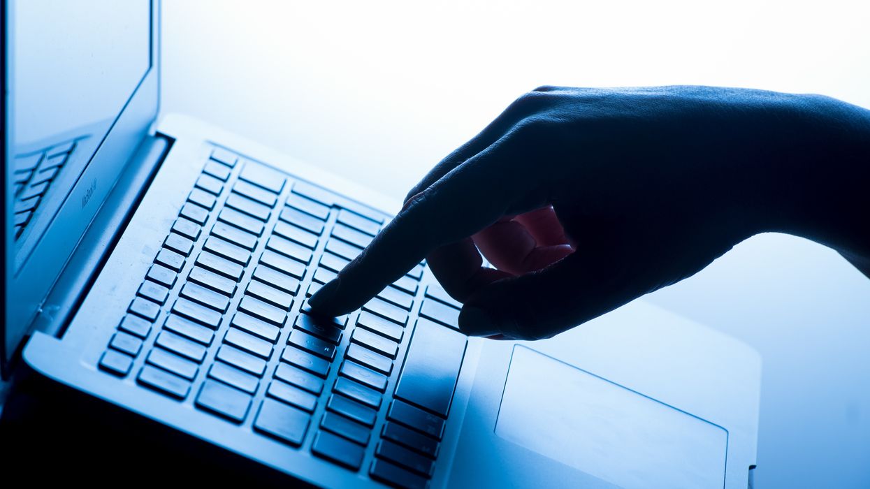 An image of a woman using a laptop