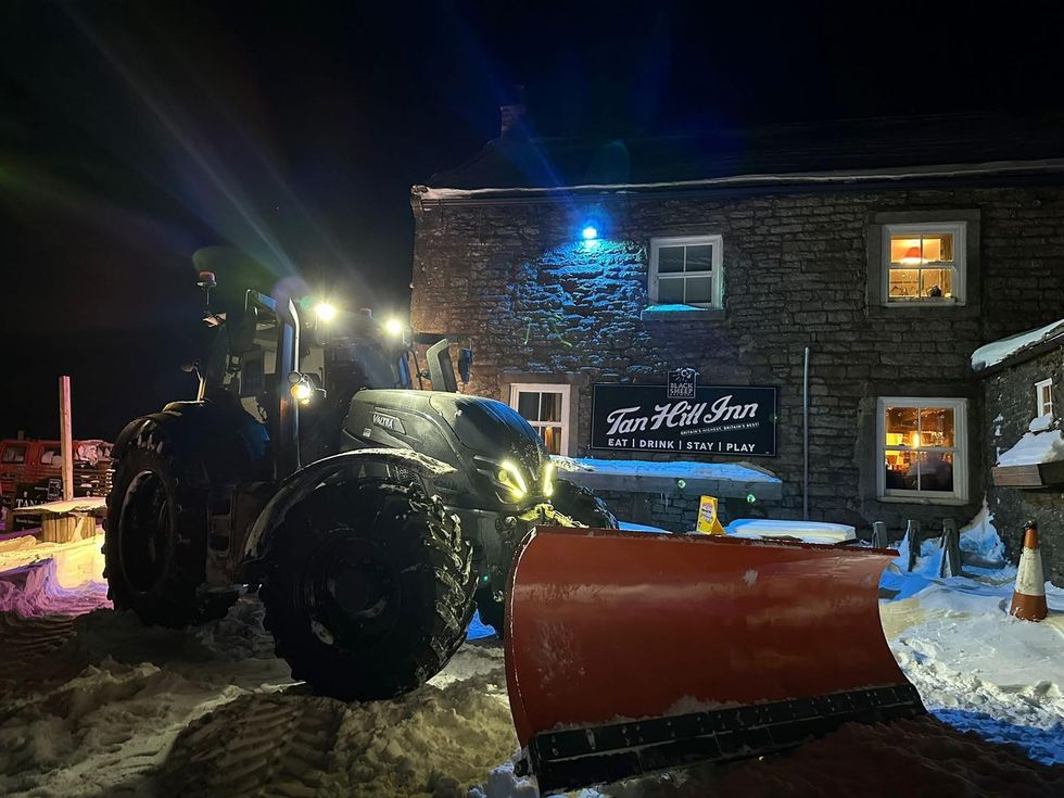 An image of attempts to clear the area around the pub