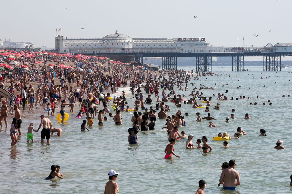 An image of Britons enjoying Brighton Beach
