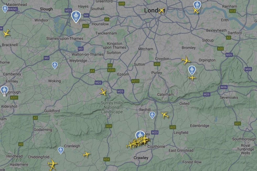 An image of flights landing at Gatwick, while Heathrow remains empty