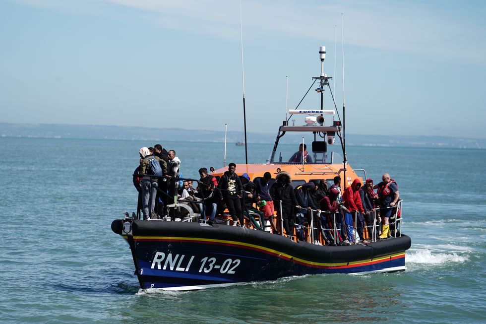 An image of migrants on an RNLI boat