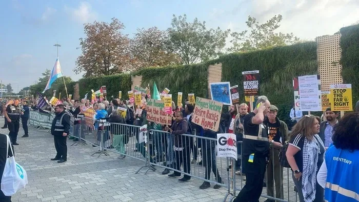 An image of protesters gathering outside Reform UK's rally in Birmingham last year