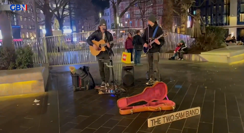 An image of Sam Monday busking