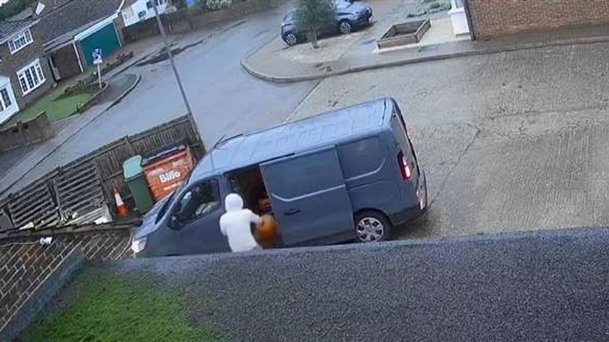 An image of the delivery driver taking the pumpkin
