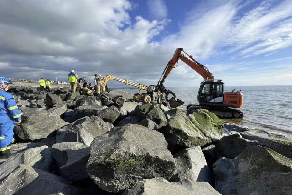 An incoming tide was perilously close to rock armour in Tywyn when a trapped girl was freed after a three-hour rescue operation