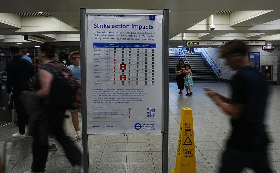 An information board warns commuters and rail users of the impact to London Underground services during a planned strike action by members of the Railway workers' union