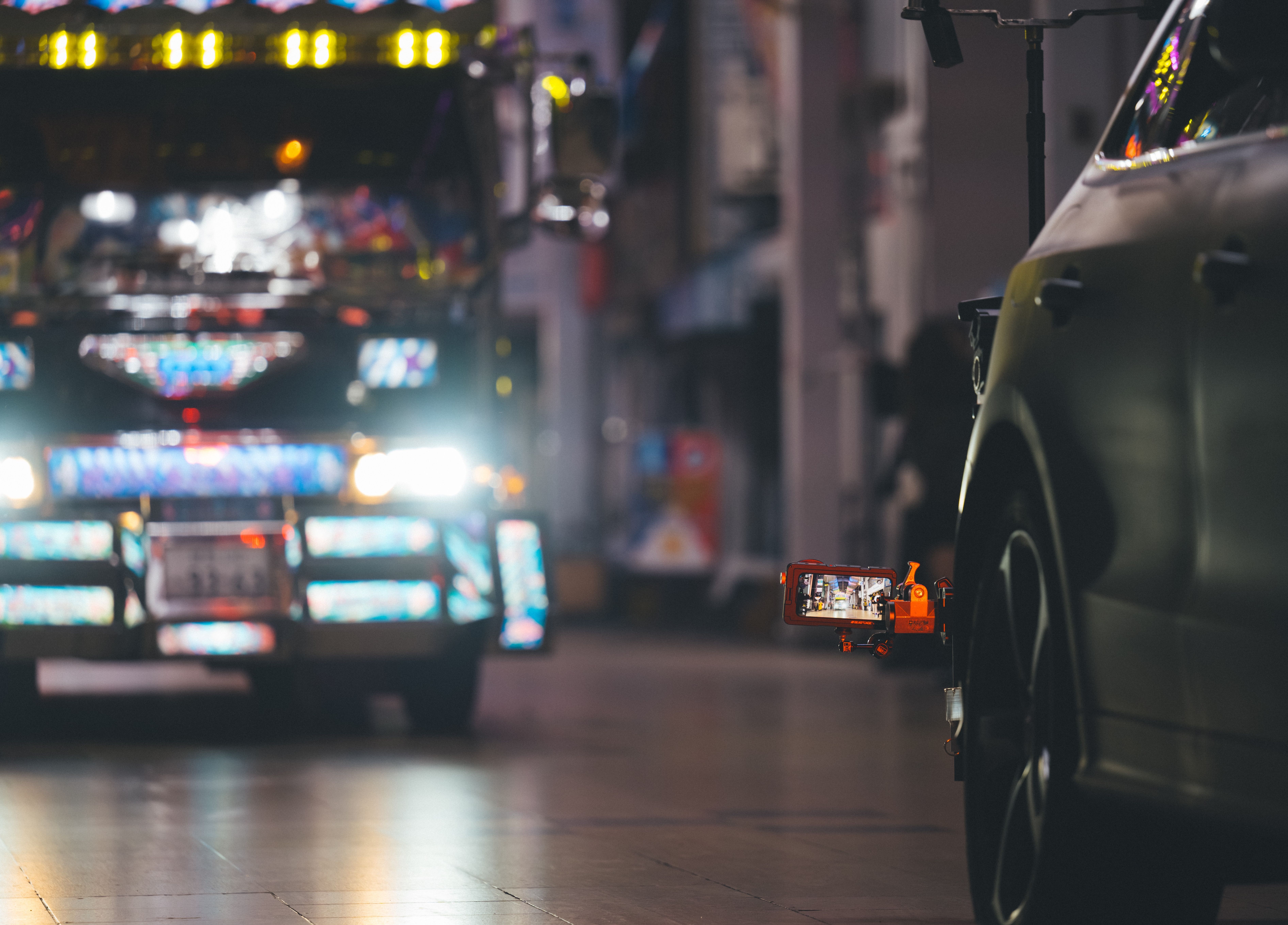 an iphone 15 pro mounted on the front of a car to film the car chase scenes