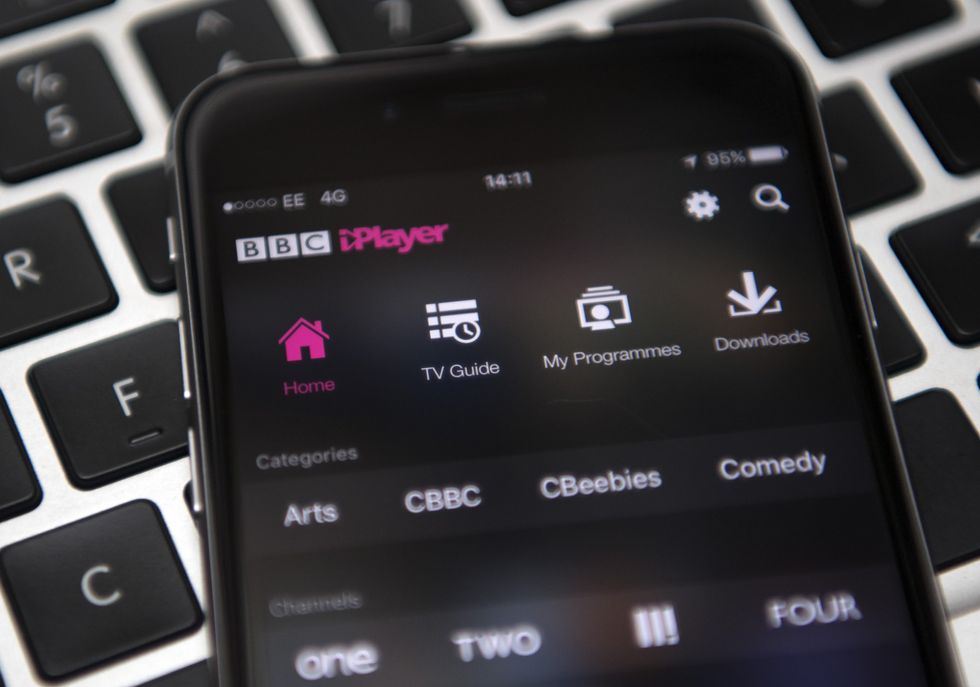 an iphone running bbc iplayer pictured lying on a keyboard 