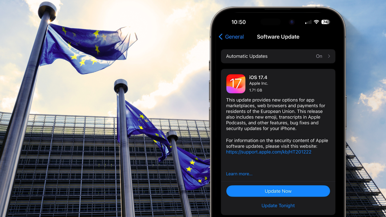 an iphone showing the ios 17.4 update on-screen is pictured infront of the european union headquarters building
