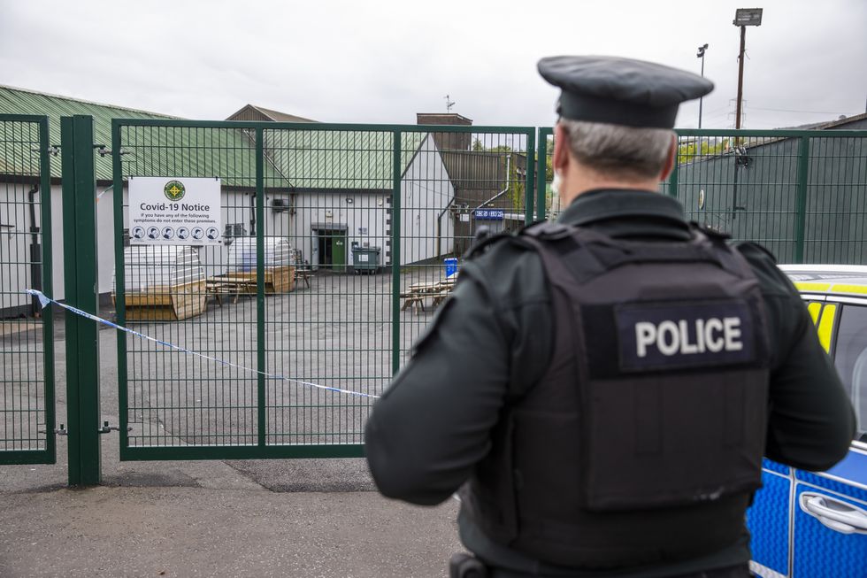 An officer from the PSNI at the scene following a shooting on Sunday of 42 year old Sean Fox at the clubhouse of Donegal Celtic Football Club, in west Belfast.