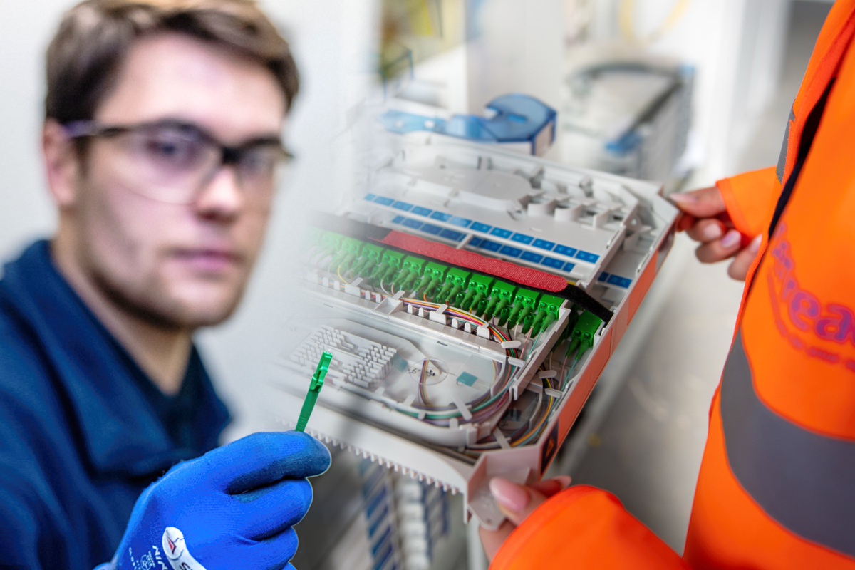 an openreach engineer holding a cable and employee in orange high-visibility jacket