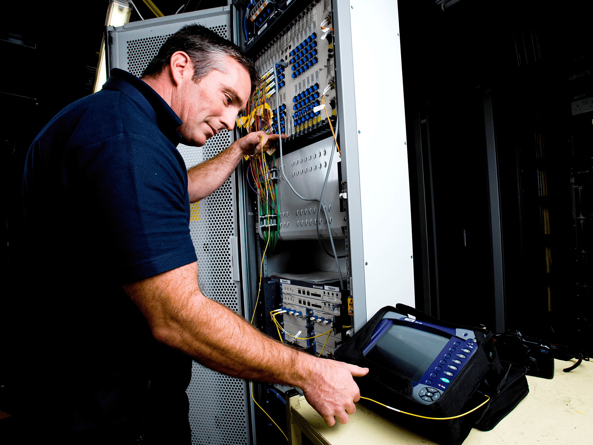 an openreach engineer pictured testing the new broadband technology that enables faster download speeds over the existing full-fibre connection
