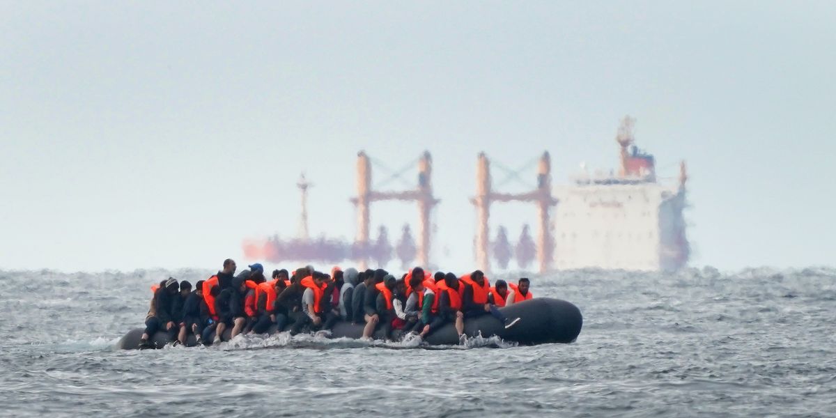 NextImg:French navy watches on as overcrowded migrant boat is just 'SECONDS from sinking' in the Channel
