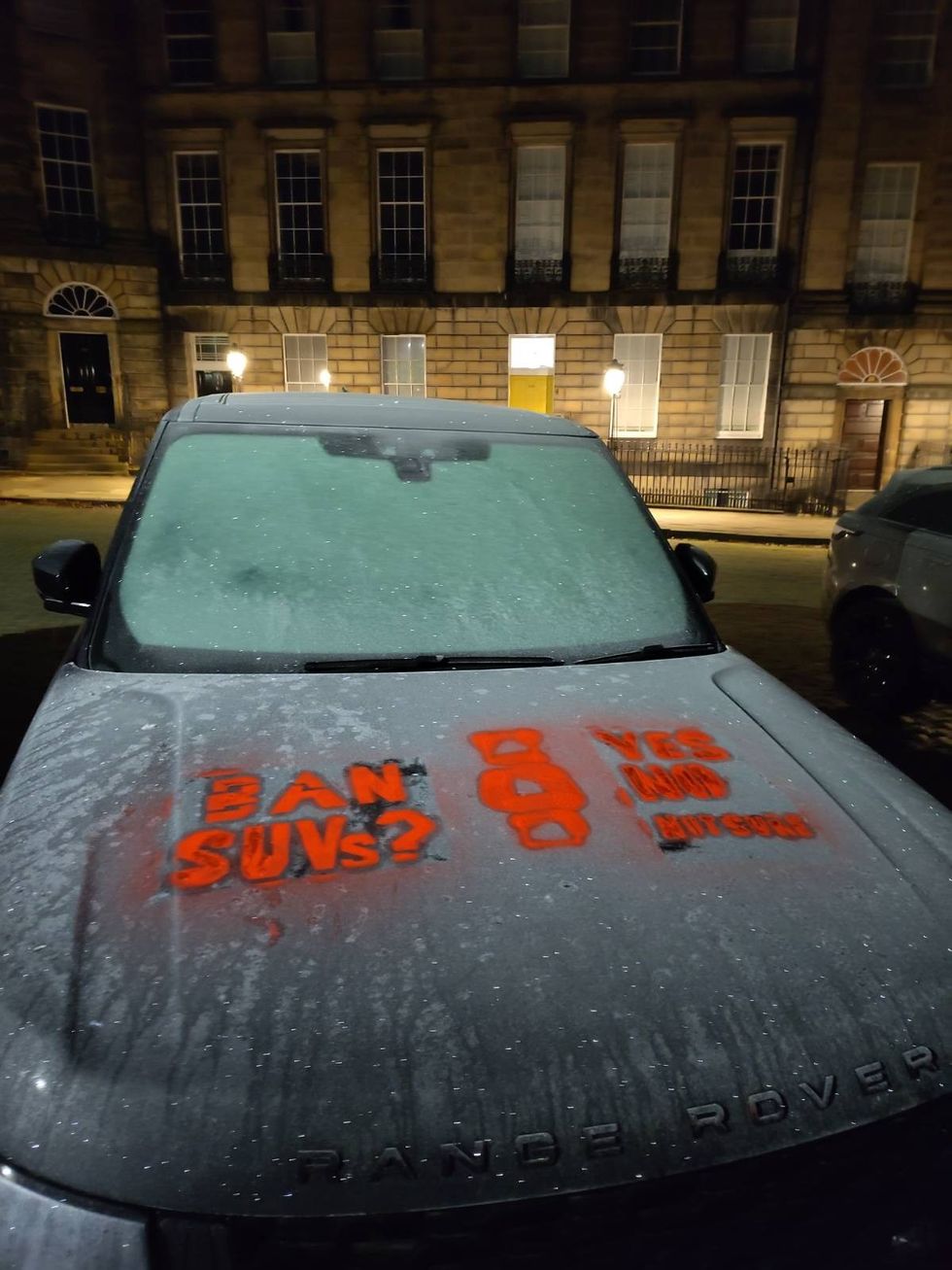 An SUV with 'Ban SUVs?' sprayed on in Edinburgh