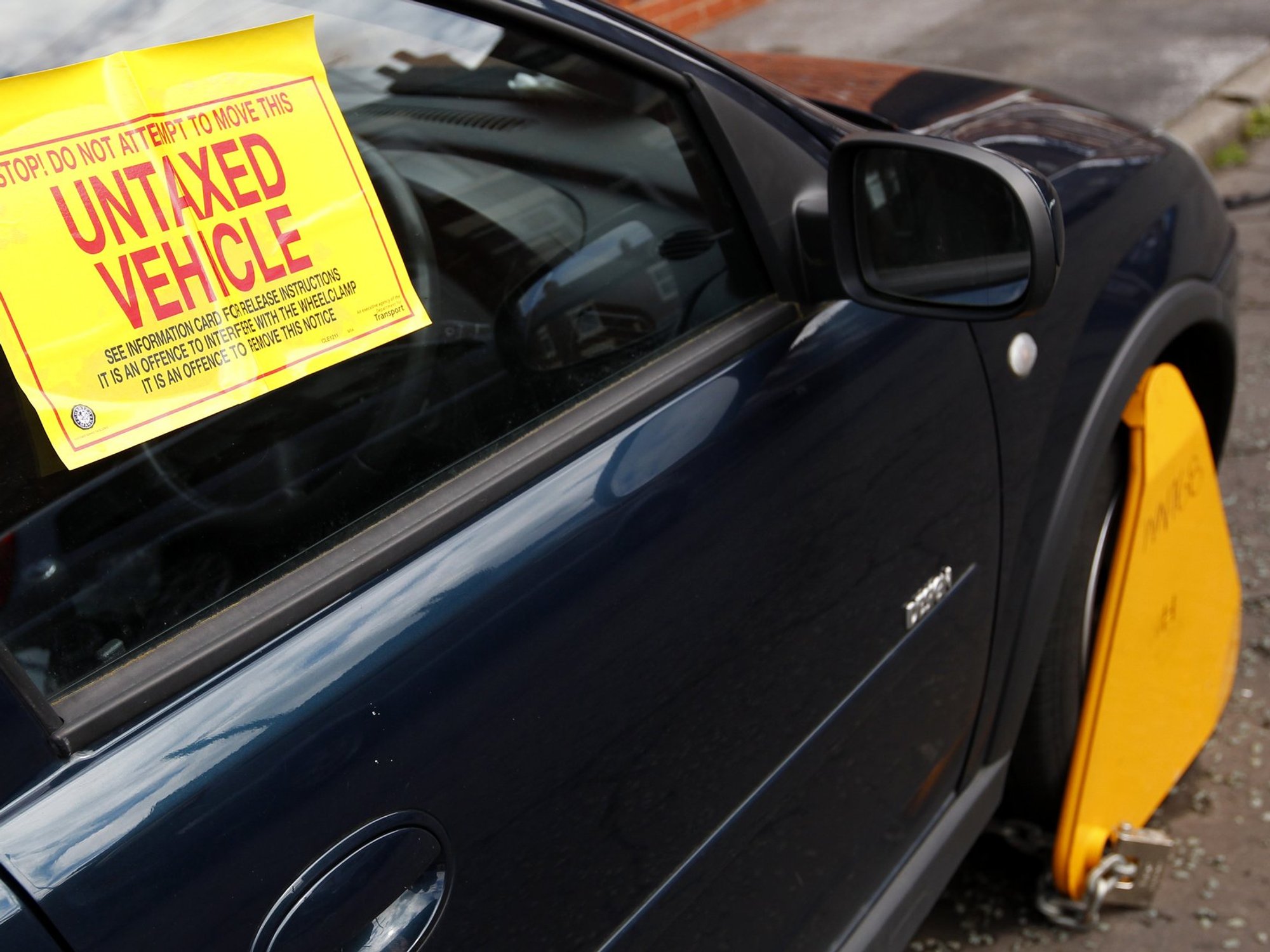 An untaxed vehicle with a DVLA wheel clamp