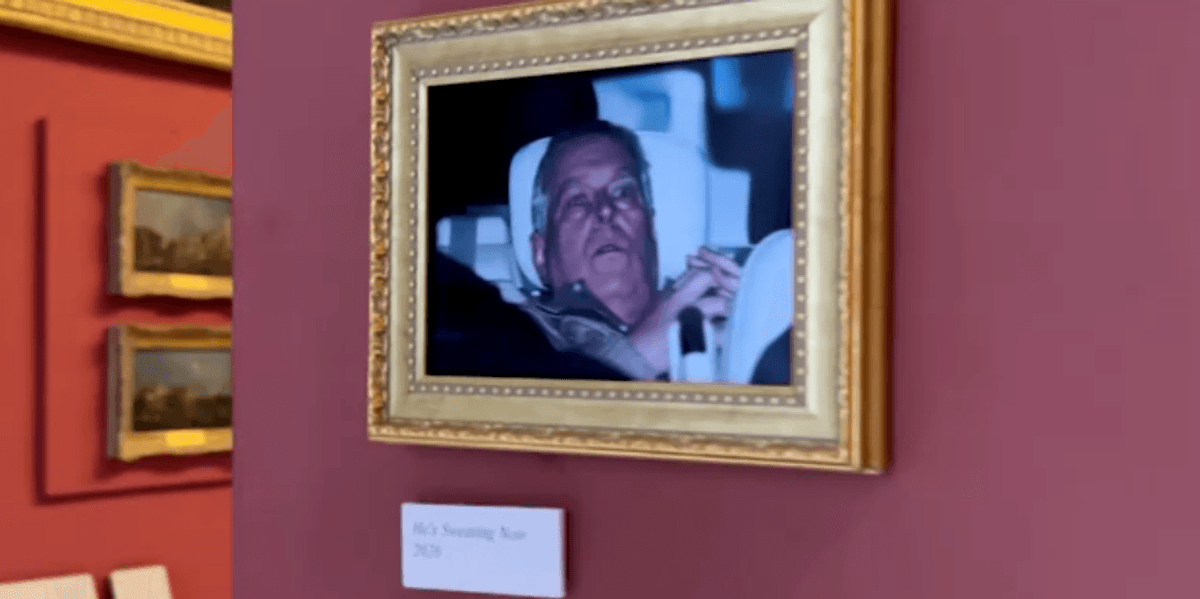 Activists hang photo of Andrew leaving police station in the Louvre Activists hang photo of Andrew leaving police station in the Louvre