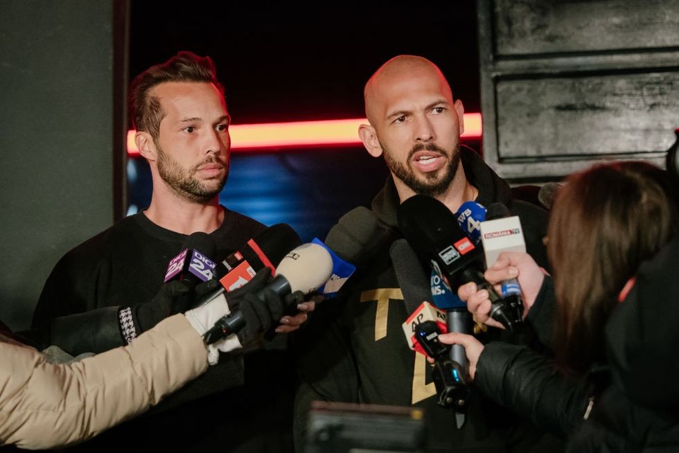 Andrew Tate and his brother Tristan Tate talk to the media outside their residence on March 23, 2025 in Bucharest, Romania.\u200b