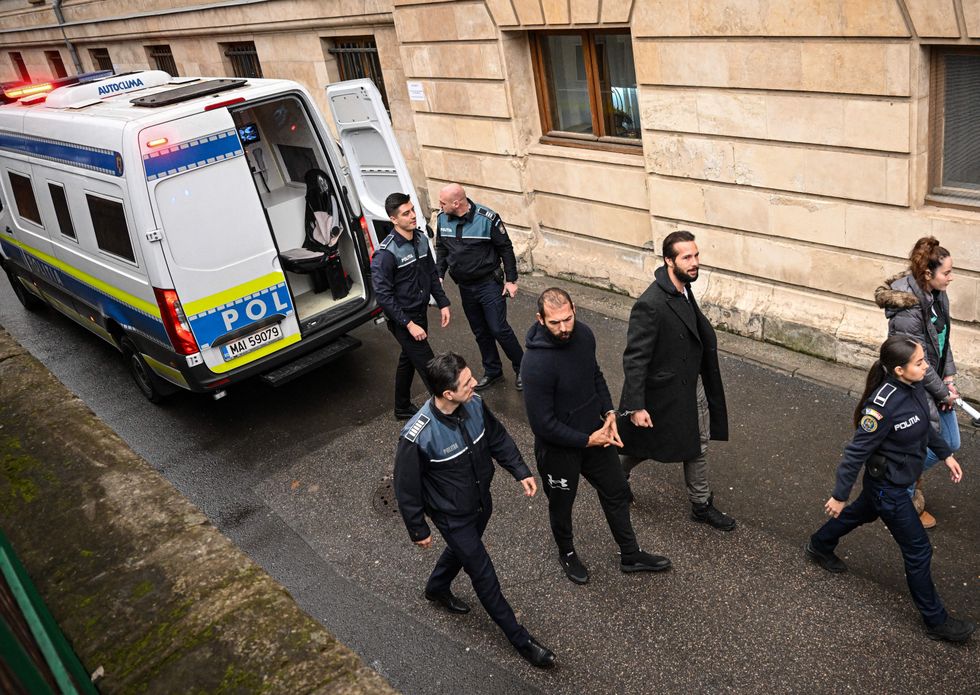 Andrew Tate (C-L) and his brother Tristan Tate (C-R) arrive at The Court of Appeal in Bucharest, Romania, on February 27, 2023