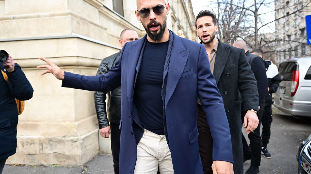 Andrew Tate (L) and Tristan Tate (R) walk from the Bucharest's Court of Appeal